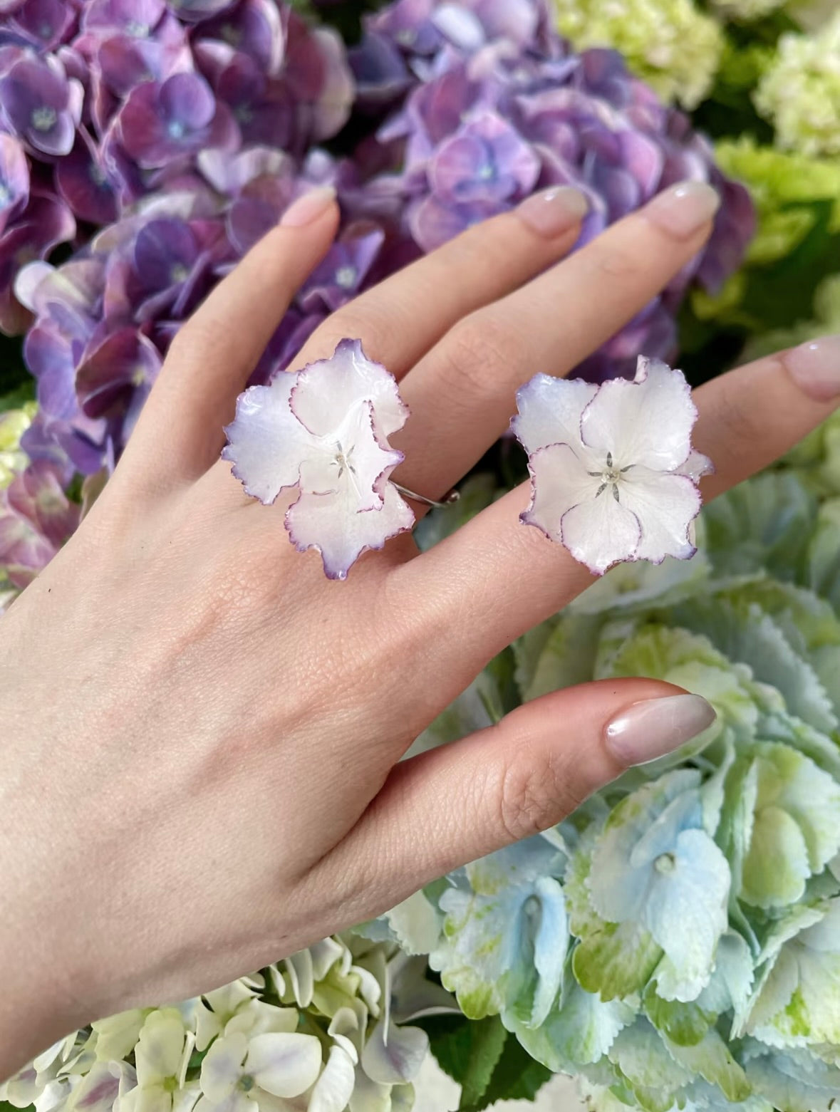 Cream White hydrangea ring with resin flower petals and adjustable gold-tone band by Terra Decode