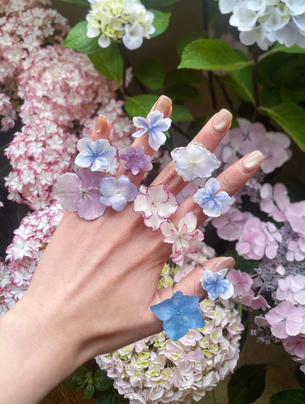 Hydrangea blue hydrangea ring variations with resin petals worn on hand by Terra Decode