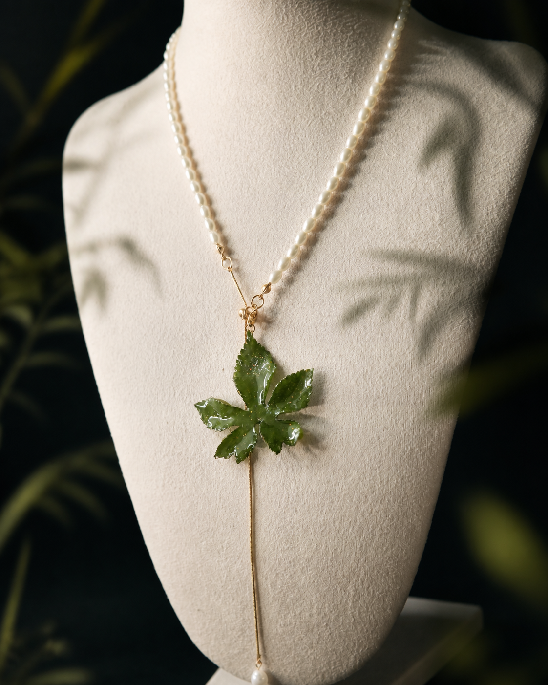 Angled view of the preserved Japanese hop leaf and pull-through chain, Japanese Hop Pearl-Drop Adjustable Lariat Necklace botanical jewellery by Terra Decode