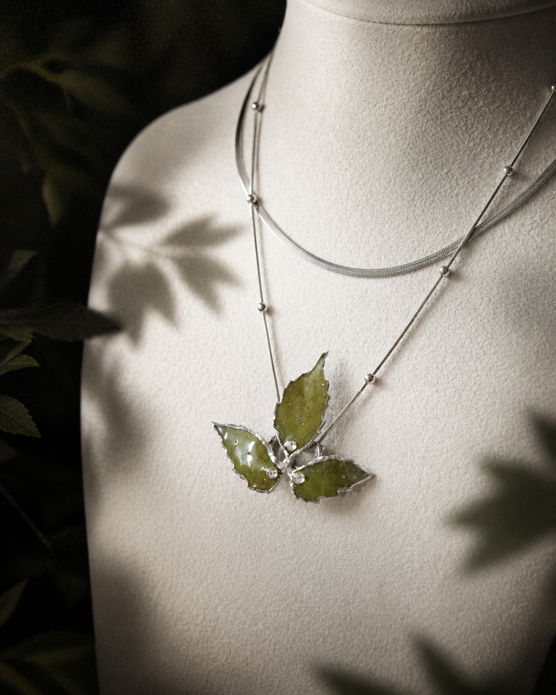 Detail of the layered silver-toned chain construction and metal beads, Layered Silver Boston Ivy Botanical Necklace botanical jewellery by Terra Decode