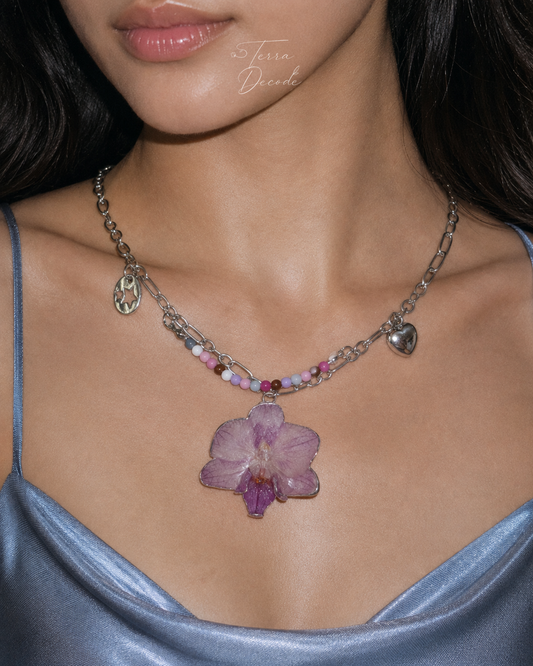 Model wearing the Lilac Phalaenopsis Pastel Bead Charm Necklace from Terra Decode's Flowers in Y2K collection