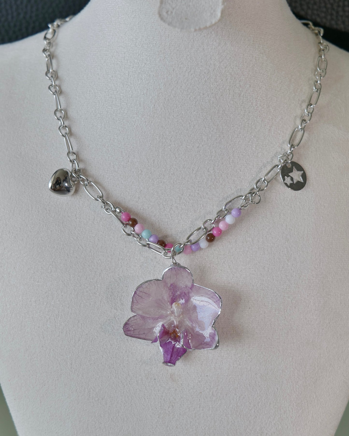 Full angled view of lilac Phalaenopsis pastel bead charm necklace