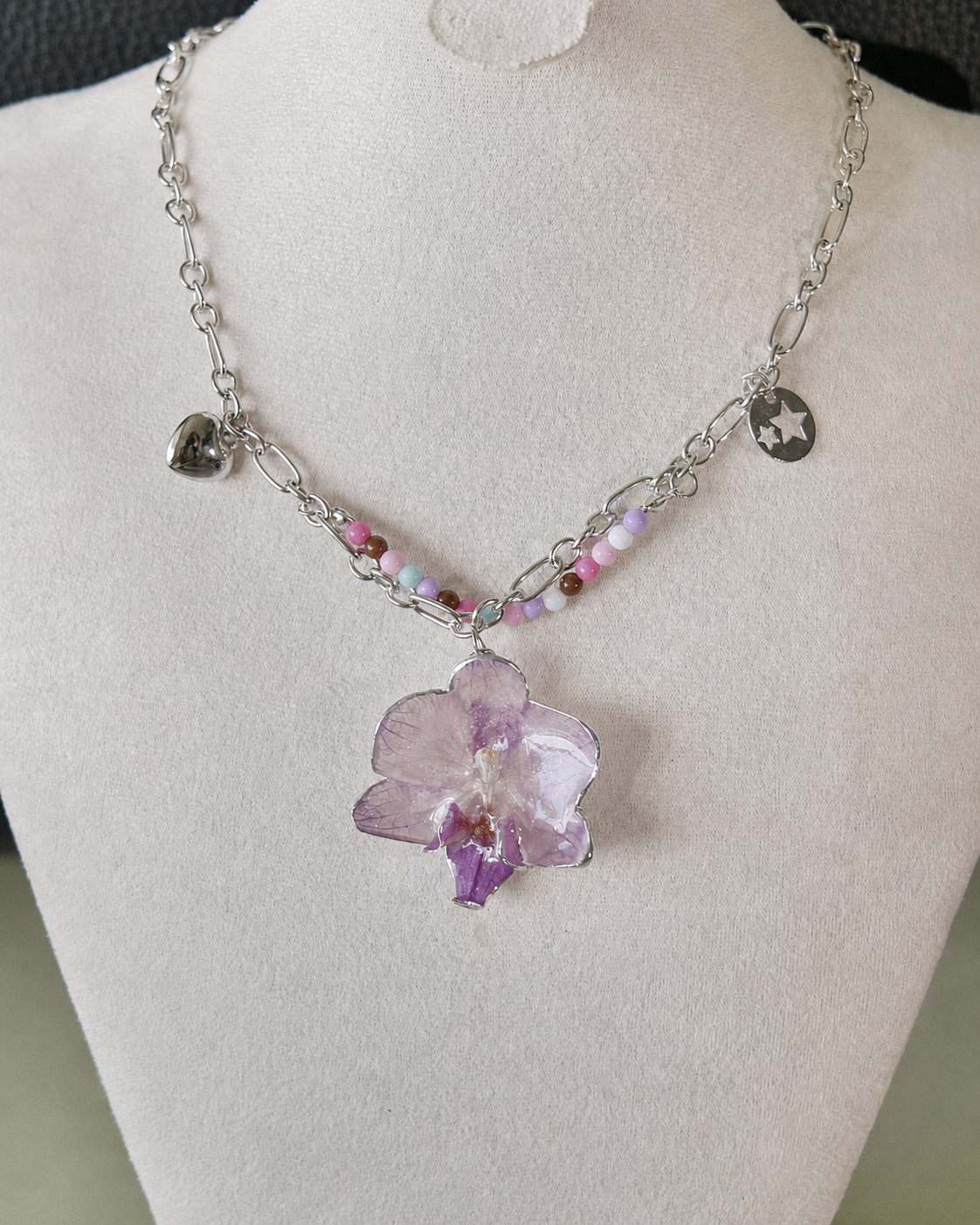 Front display view of the Lilac Phalaenopsis Pastel Bead Charm Necklace, Lilac Phalaenopsis Pastel Bead Charm Necklace botanical jewellery by Terra Decode