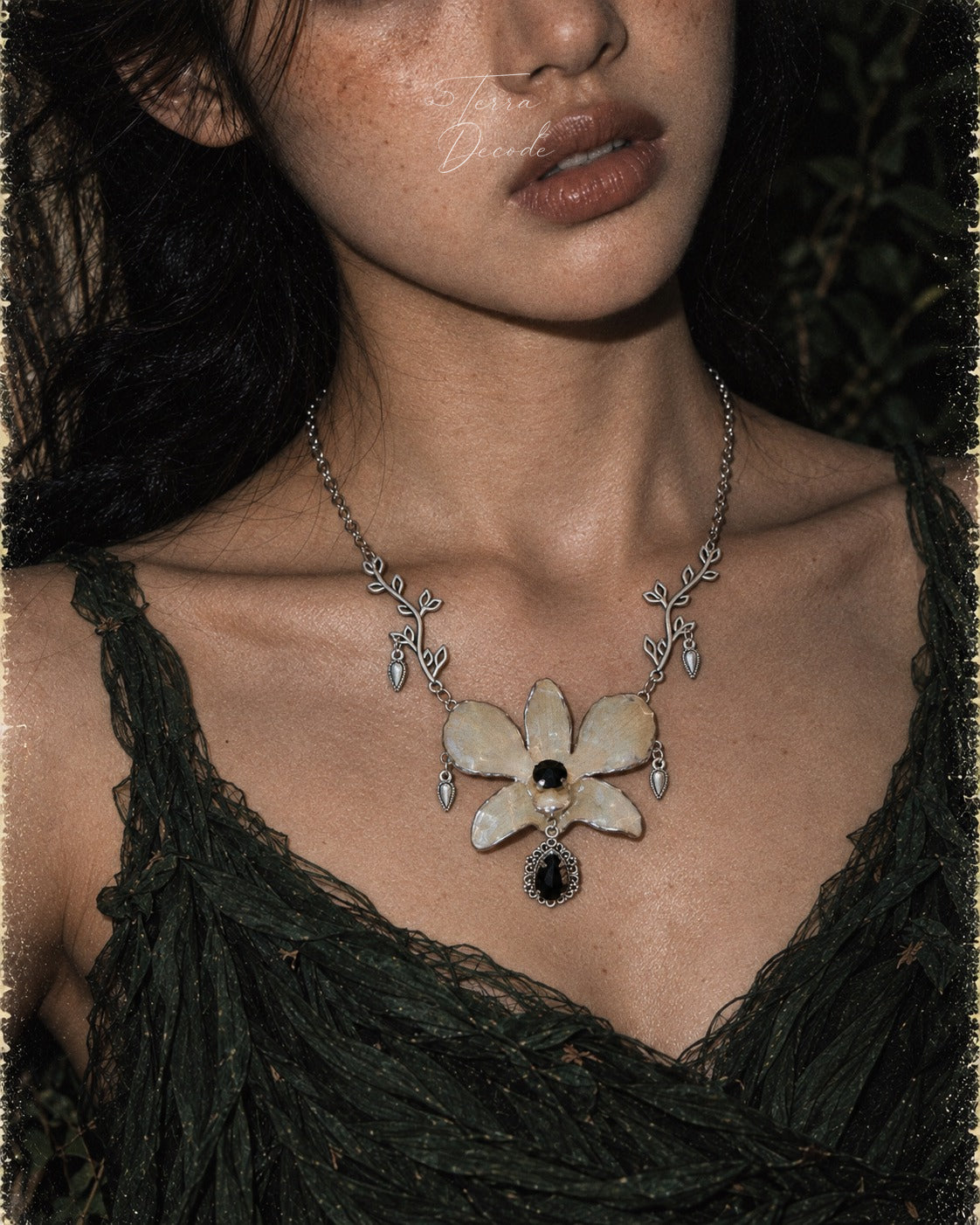 NOCTURNE White Dendrobium Black Crystal Vintage Pendant Necklace worn by a model | Terra Decode