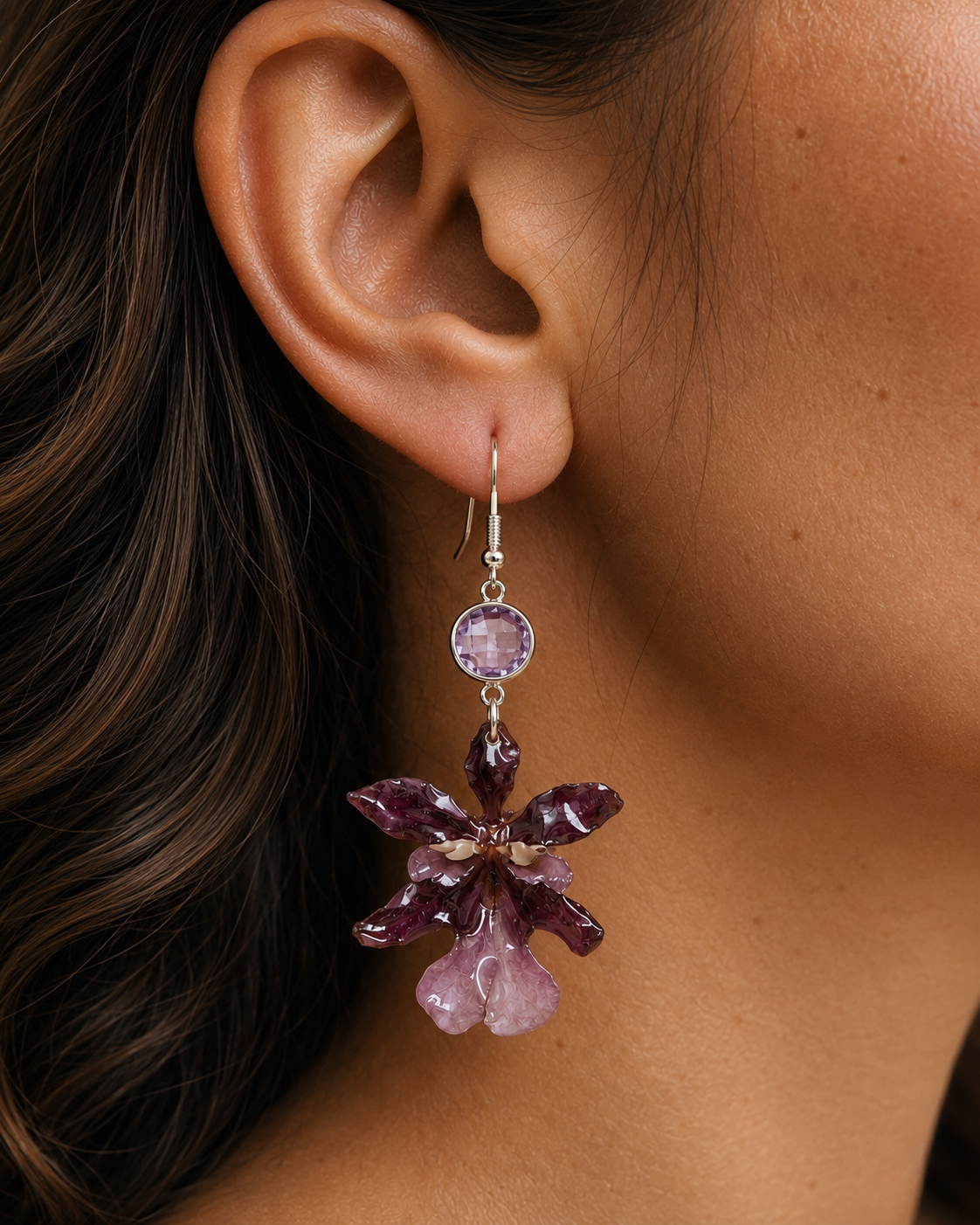 Model wearing deep plum Oncidium orchid drop earrings with a purple crystal accent, Oncidium Orchid Drop Earrings botanical jewellery by Terra Decode