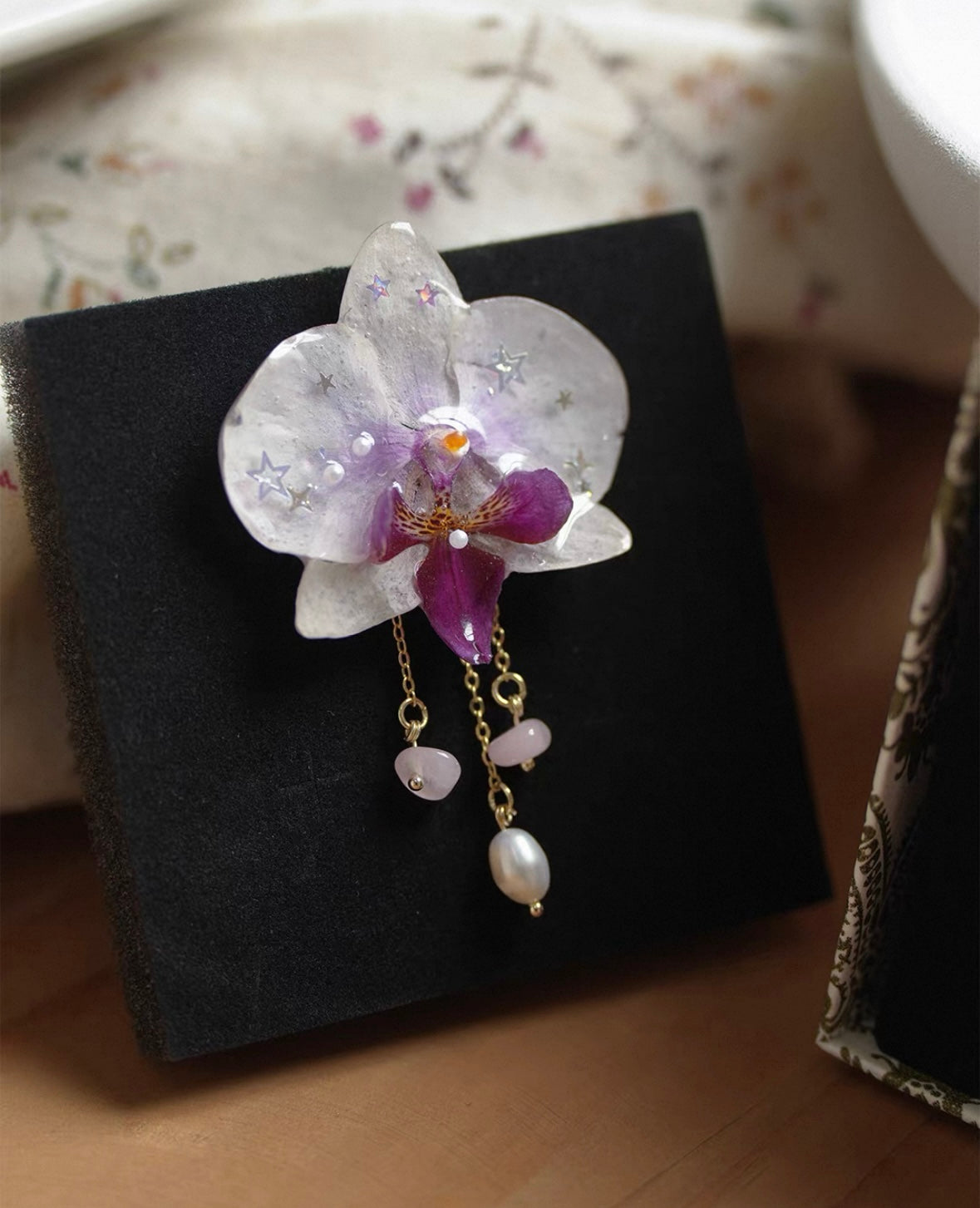 White Pearl Detail orchid brooch with resin petals and pearl-like drops by Terra Decode