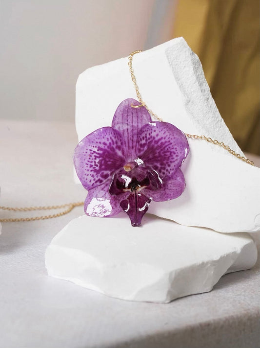 Soft Purple orchid necklace with resin flower pendant and gold-tone chain by Terra Decode