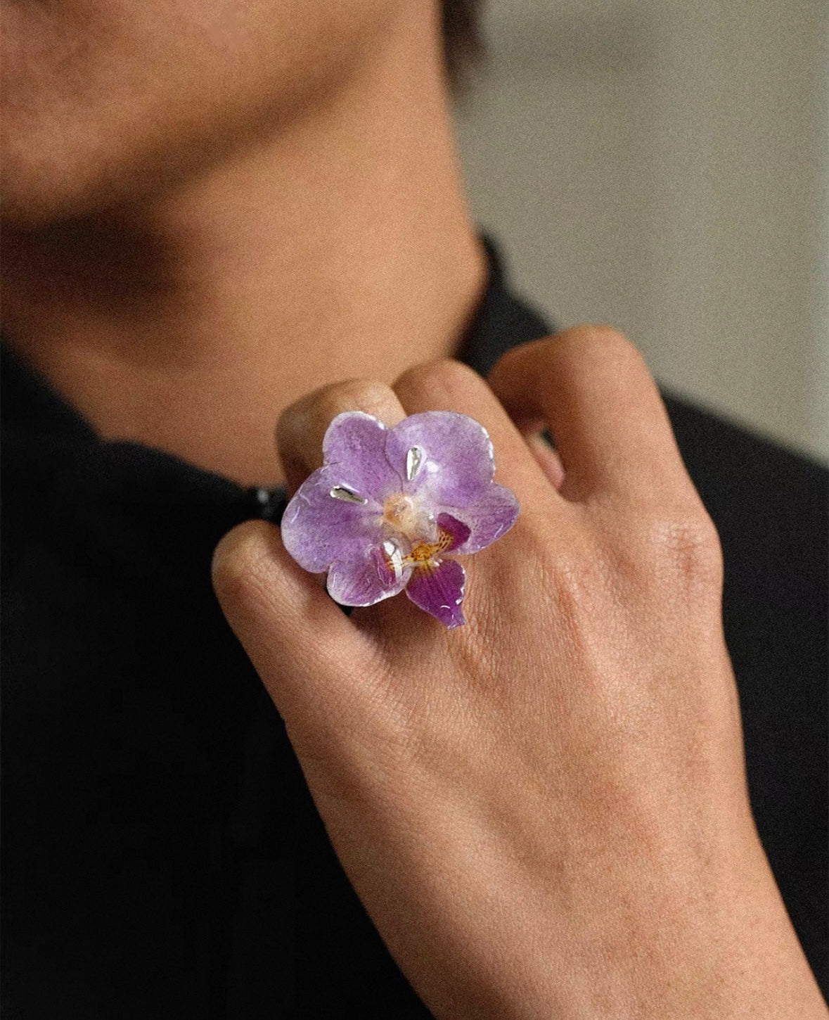 Soft purple orchid ring with resin petals and botanical styling by Terra Decode