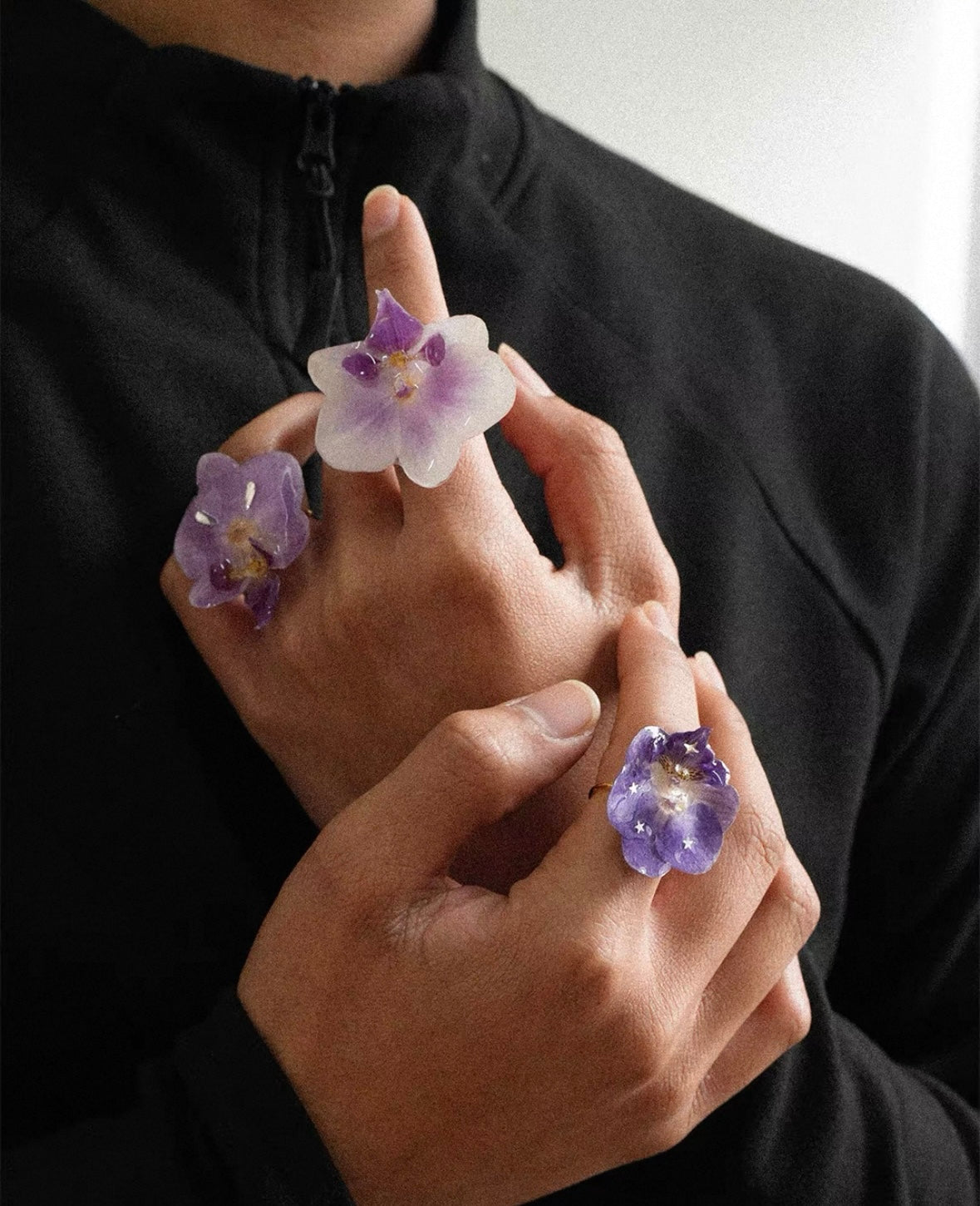 Soft purple orchid ring variations with resin petals worn as botanical statement jewellery by Terra Decode