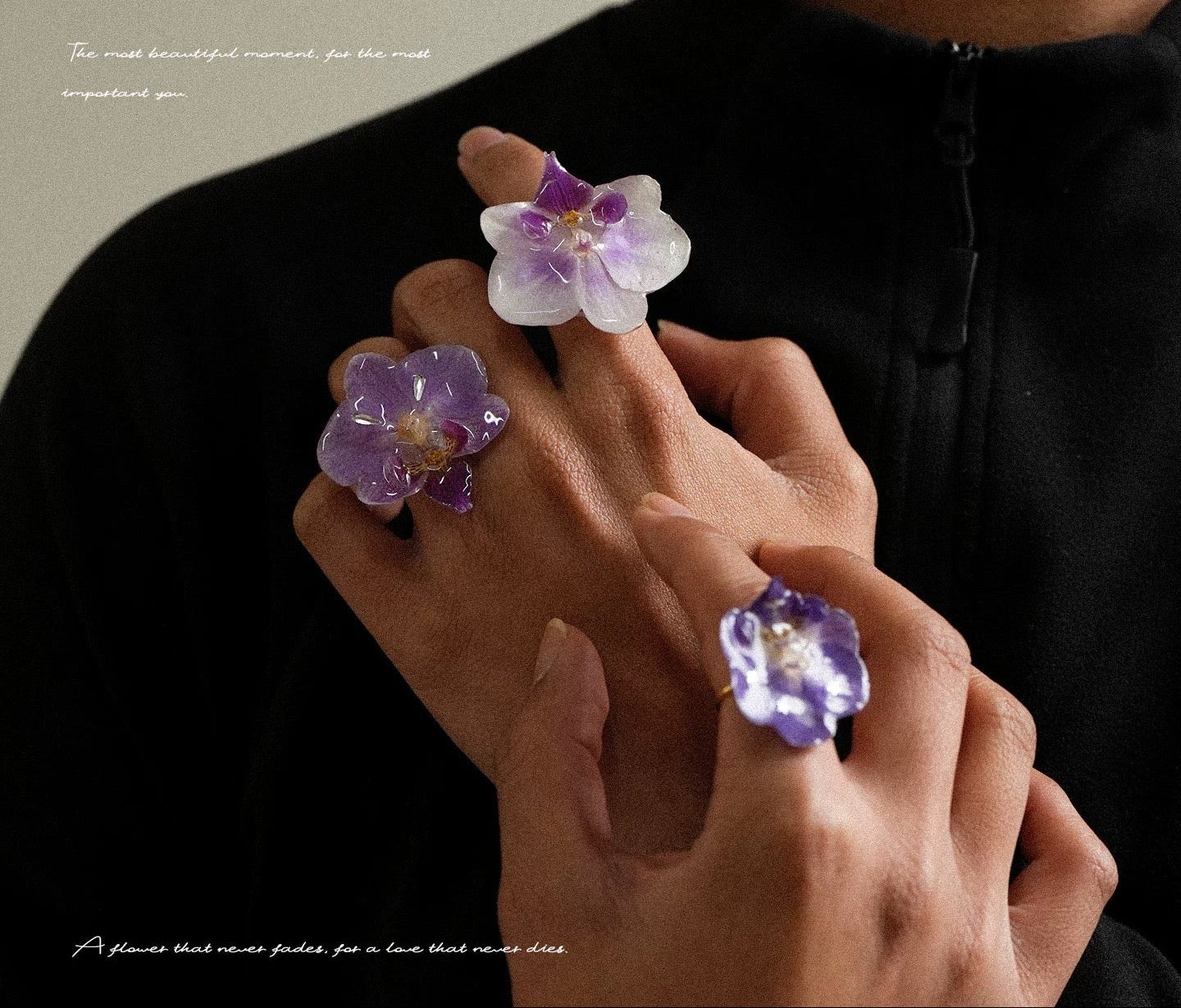 Soft purple and deep purple orchid statement rings with resin petals worn on hands by Terra Decode