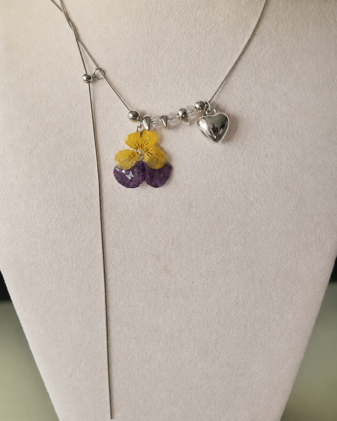 Full display view showing the Pansy Heart Adjustable Lariat Necklace construction, Pansy Heart Adjustable Lariat Necklace botanical jewellery by Terra Decode