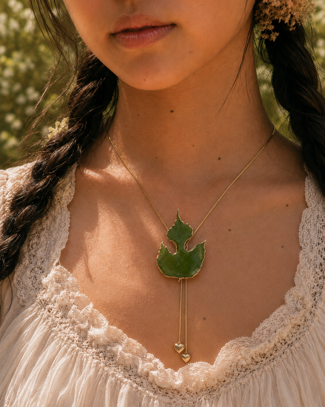 Model wearing the Paper Mulberry Double-Heart Lariat Necklace by Terra Decode