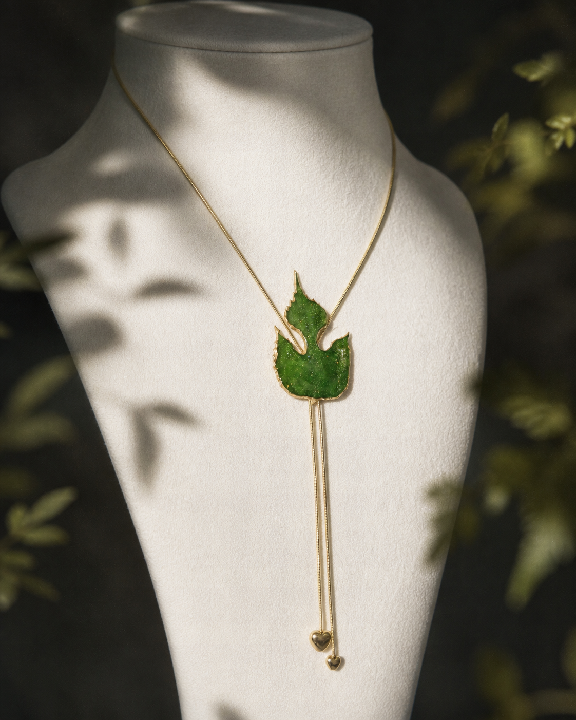 Right angled view of the real-leaf pendant and double-heart design, Paper Mulberry Double-Heart Lariat Necklace botanical jewellery by Terra Decode