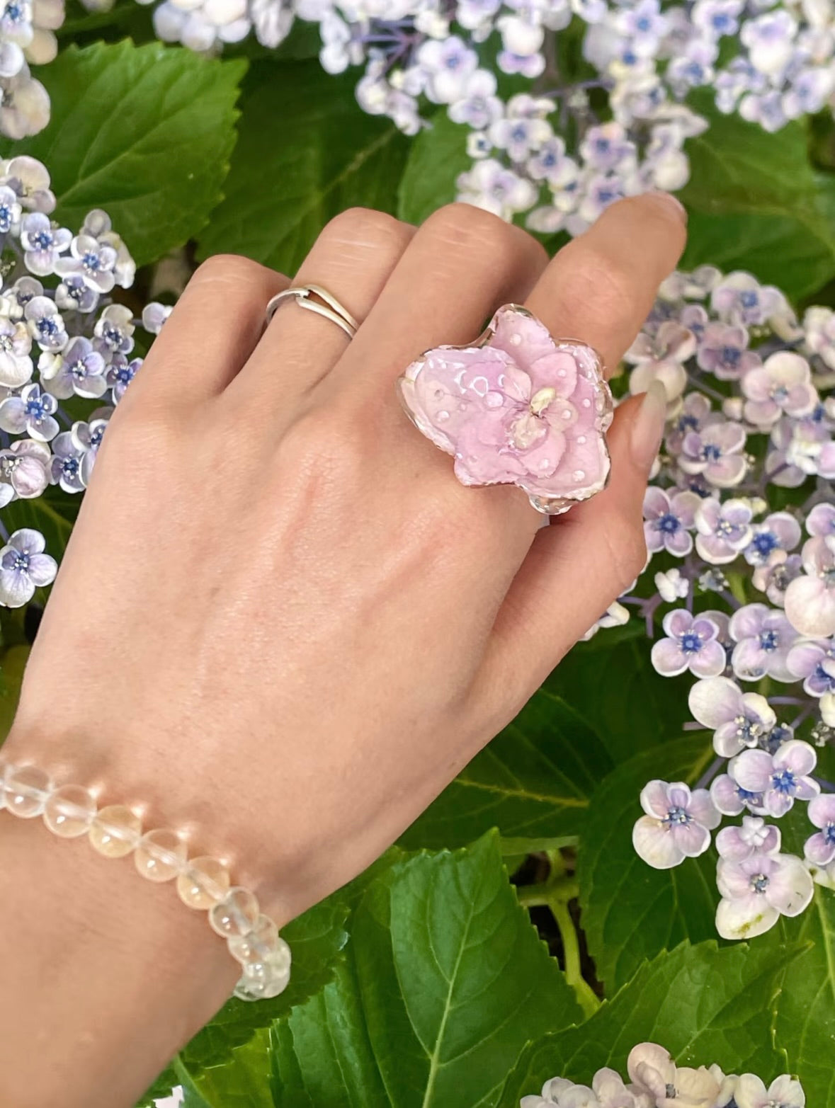 Soft Pink hydrangea ring with translucent resin petals and adjustable metal band by Terra Decode