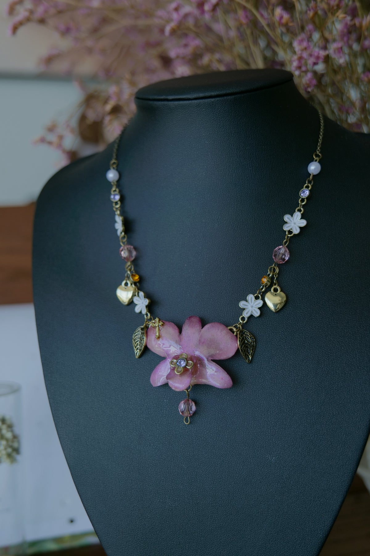 Close-up of the real preserved pink-purple Dendrobium orchid centrepiece