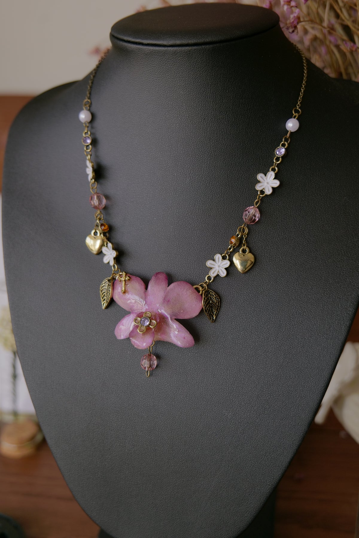 Full view of the one-of-a-kind pink-purple Dendrobium botanical necklace