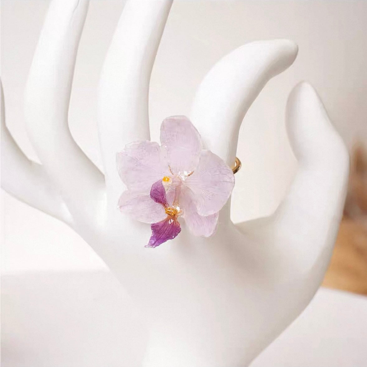 Cream White orchid ring with resin petals and adjustable gold-tone band by Terra Decode