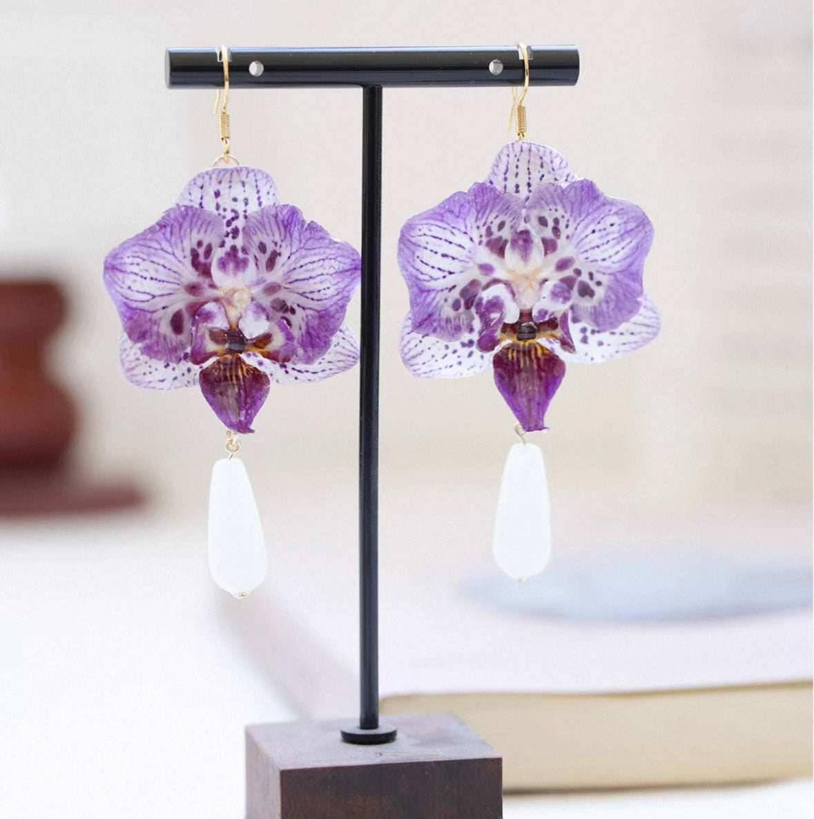 Purple Teardrop orchid earrings with resin petals and white drop detail by Terra Decode