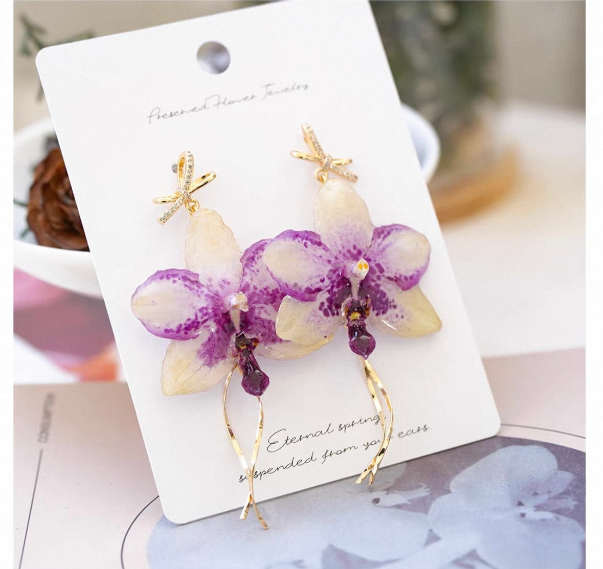 Bow chain detail orchid earrings with resin petals, bow accent and chain detail by Terra Decode