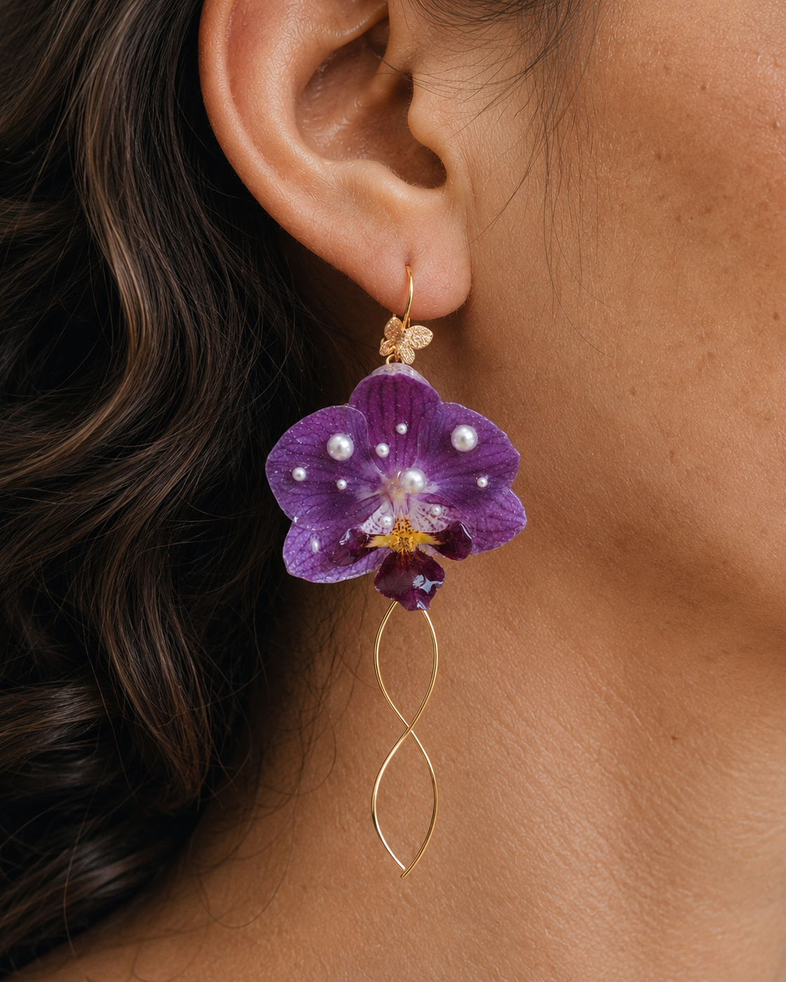 Model wearing purple orchid tassel earrings with pearl accents and a gold-tone wire drop, Purple Orchid Tassel Earrings botanical jewellery by Terra Decode