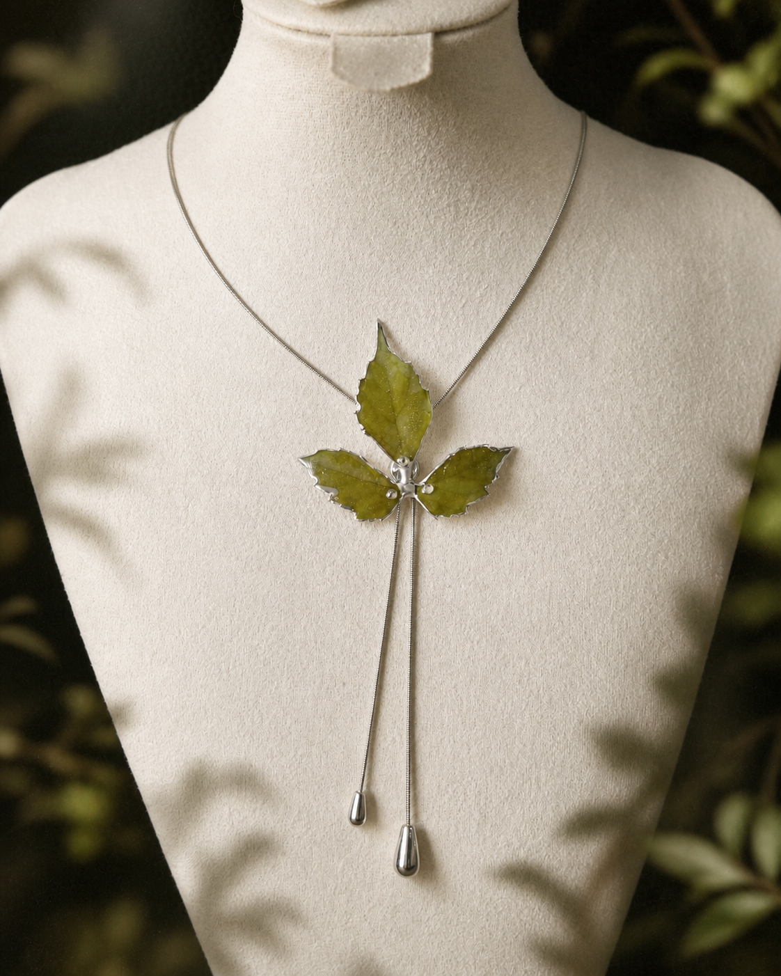 Right angled view of the preserved Boston ivy leaves and twin-drop design, Silver-Toned Boston Ivy Twin-Drop Lariat Necklace botanical jewellery by Terra Decode