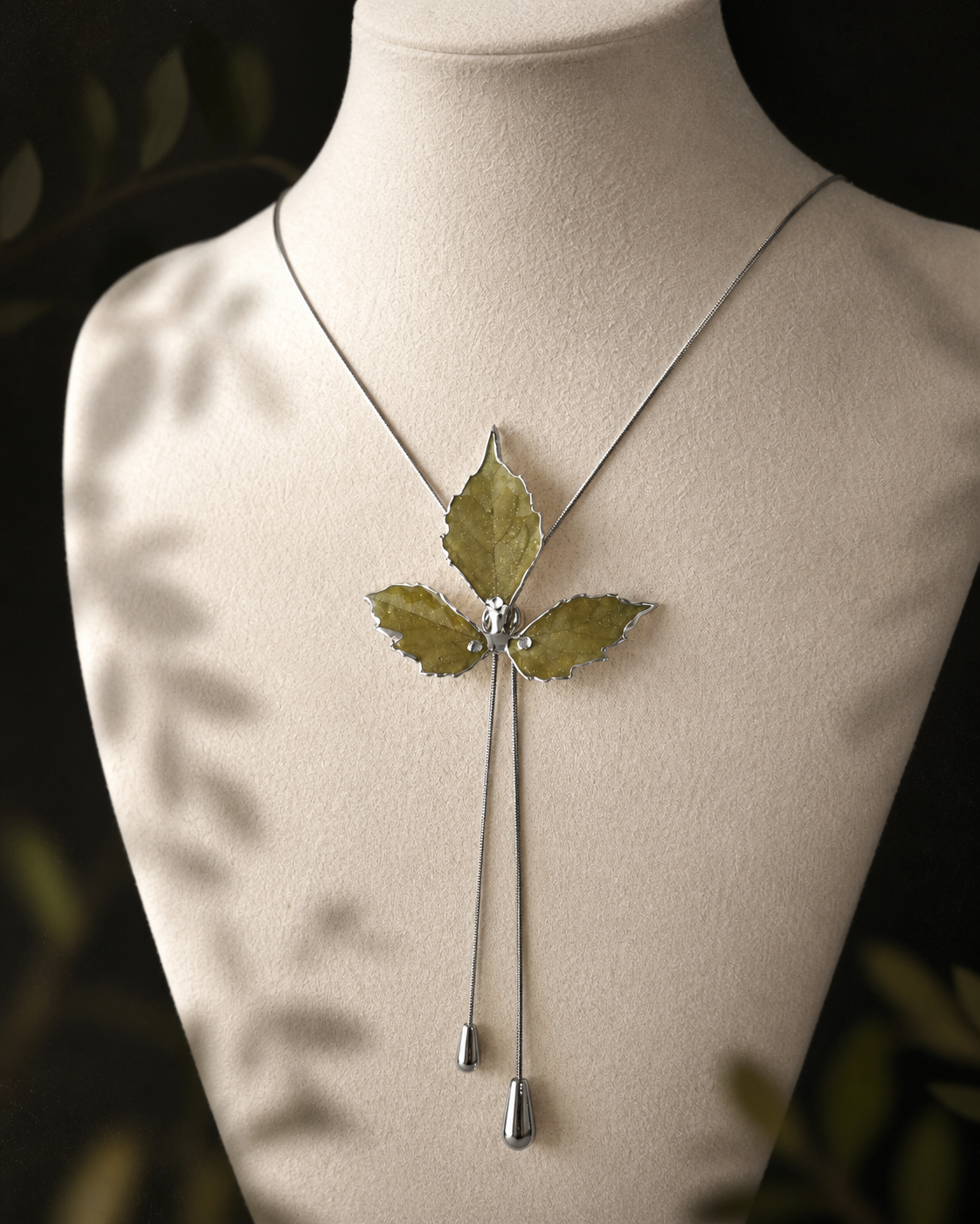 Full-length view of the botanical lariat necklace and twin polished drops, Silver-Toned Boston Ivy Twin-Drop Lariat Necklace botanical jewellery by Terra Decode