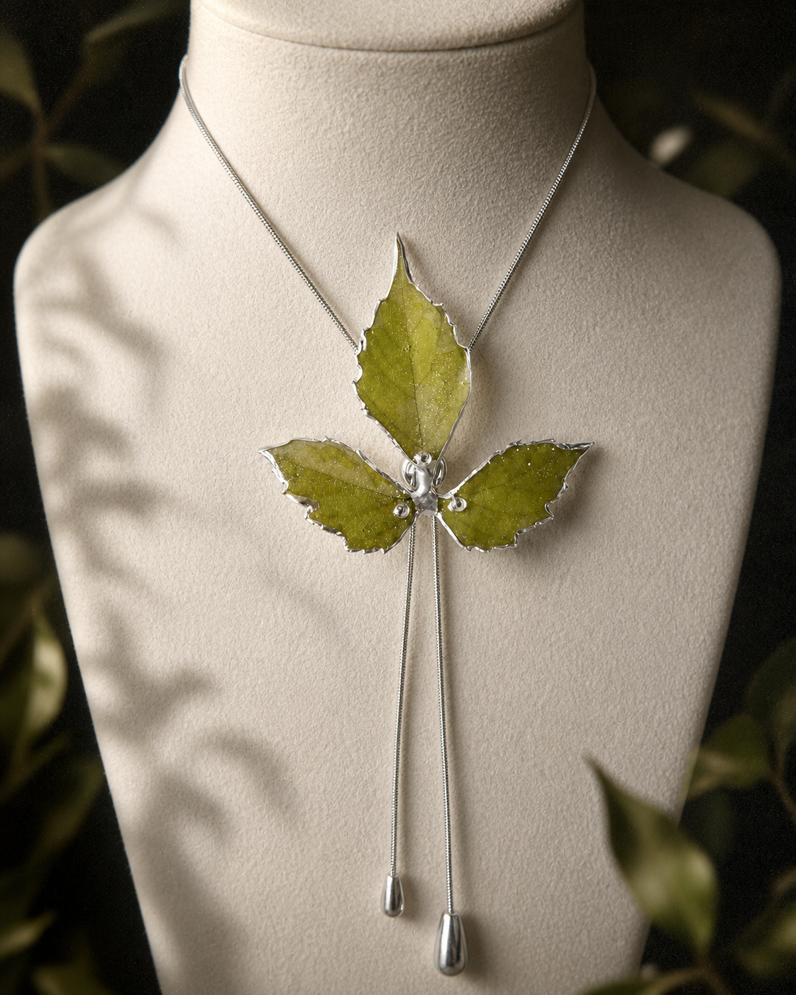 Detail of the silver-toned lariat chain and polished metal components, Silver-Toned Boston Ivy Twin-Drop Lariat Necklace botanical jewellery by Terra Decode