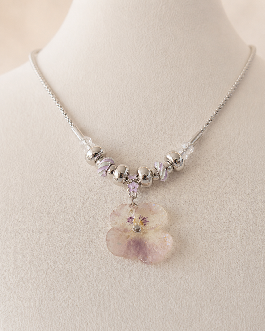 Full display view of the beaded botanical necklace and clear faceted accents, Smoky Pink Pansy Beaded Necklace botanical jewellery by Terra Decode