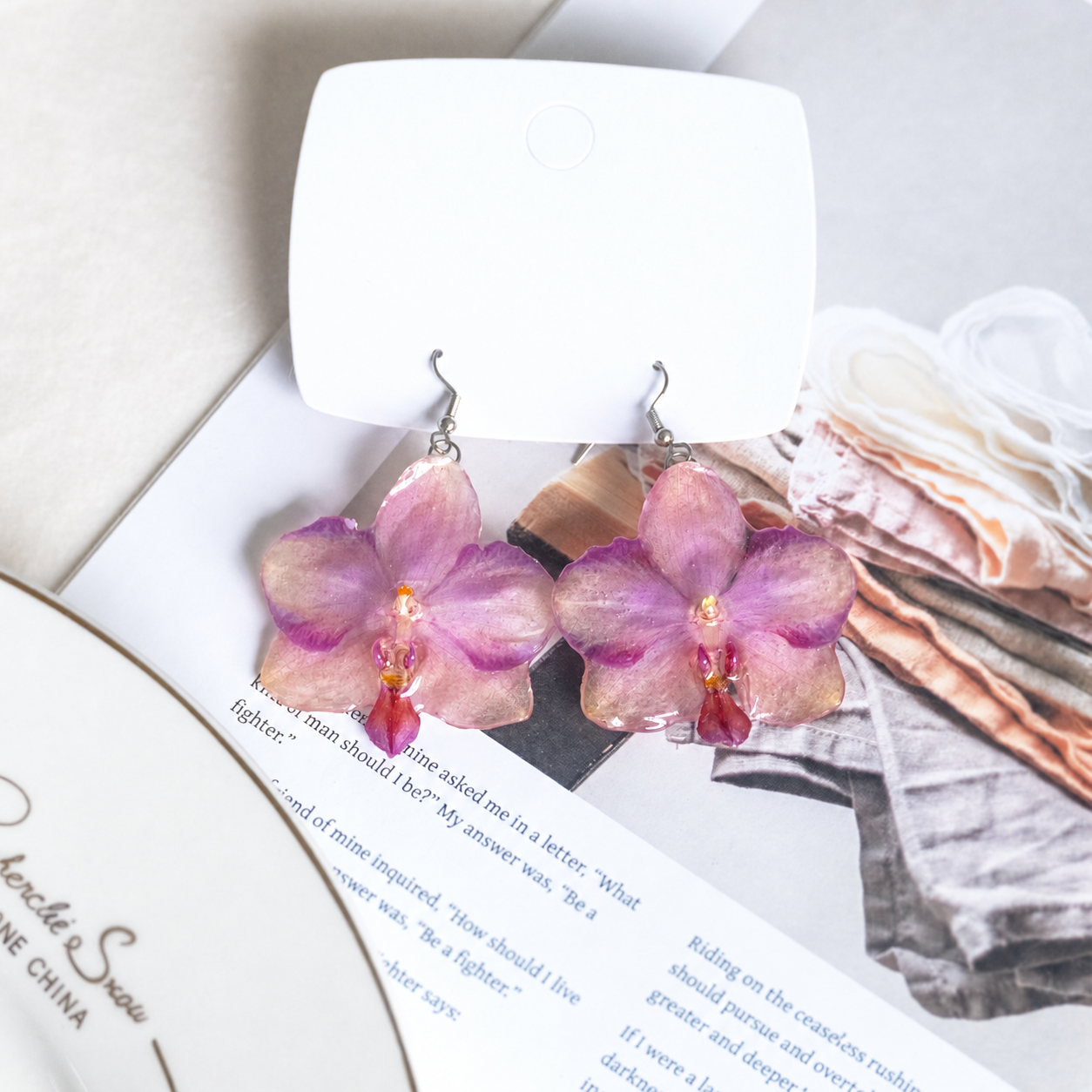 Close-up of glossy Phalaenopsis petals showing pink, lilac and amber botanical details, Sunset Pink Phalaenopsis Drop Earrings botanical jewellery by Terra Decode