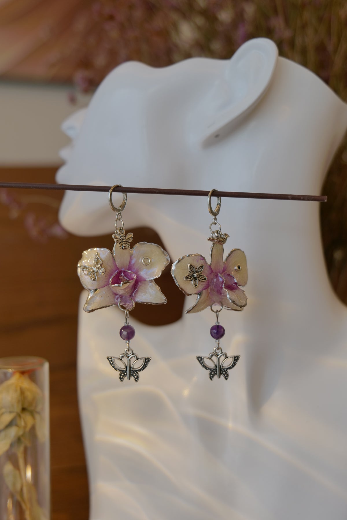 LUNARIA — Asymmetric Dendrobium Butterfly & Bee Earrings by Terra Decode — product photograph 1 showing the handmade botanical earrings.