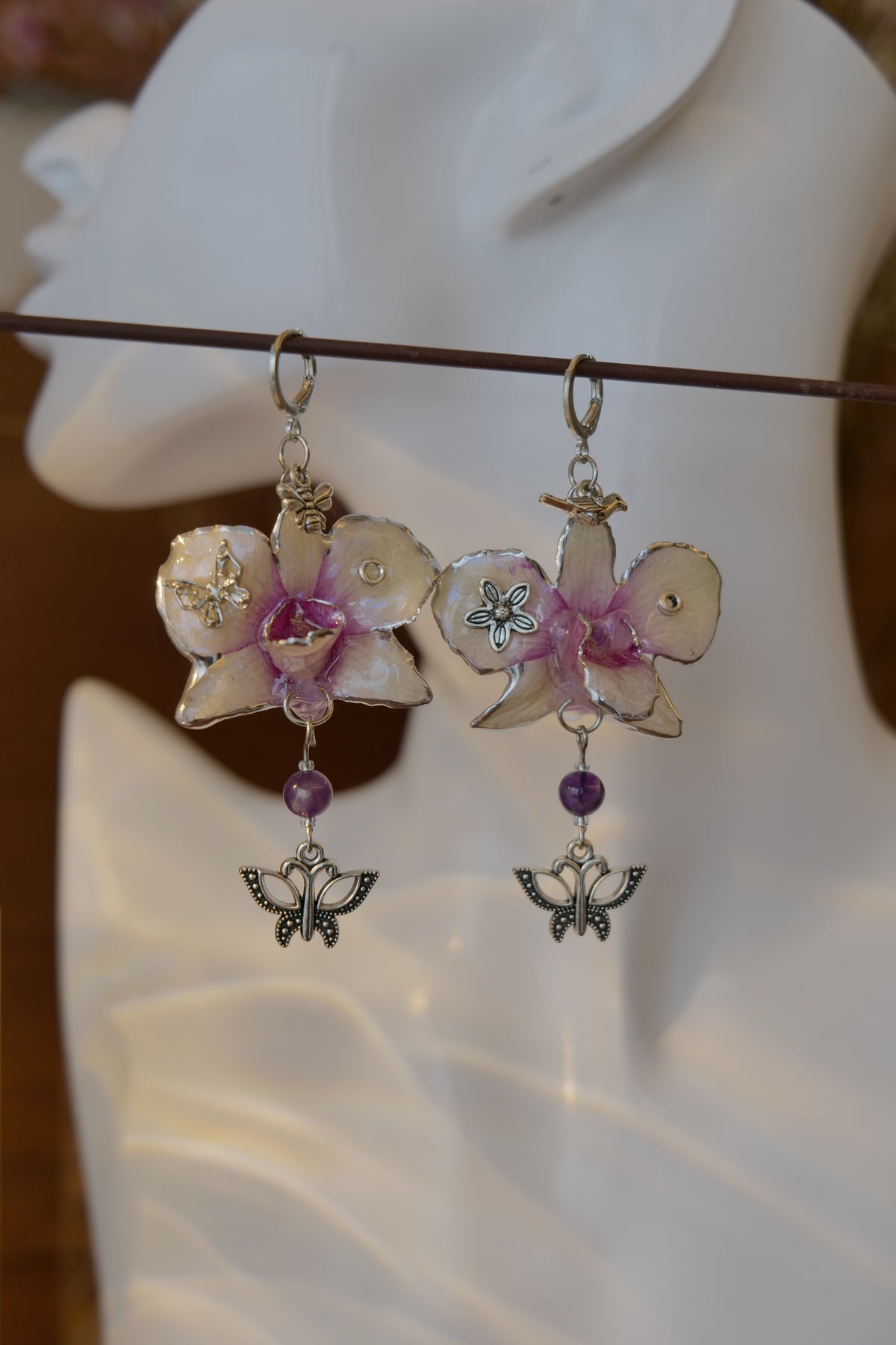 LUNARIA — Asymmetric Dendrobium Butterfly & Bee Earrings by Terra Decode — product photograph 2 showing the handmade botanical earrings.
