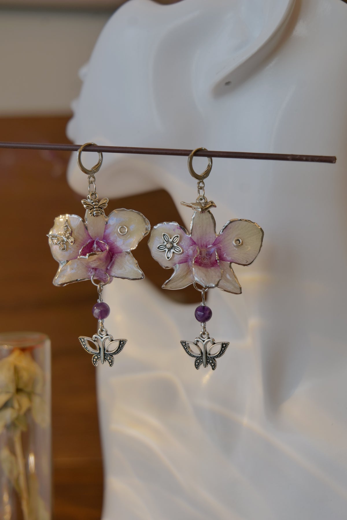 LUNARIA — Asymmetric Dendrobium Butterfly & Bee Earrings by Terra Decode — product photograph 3 showing the handmade botanical earrings.