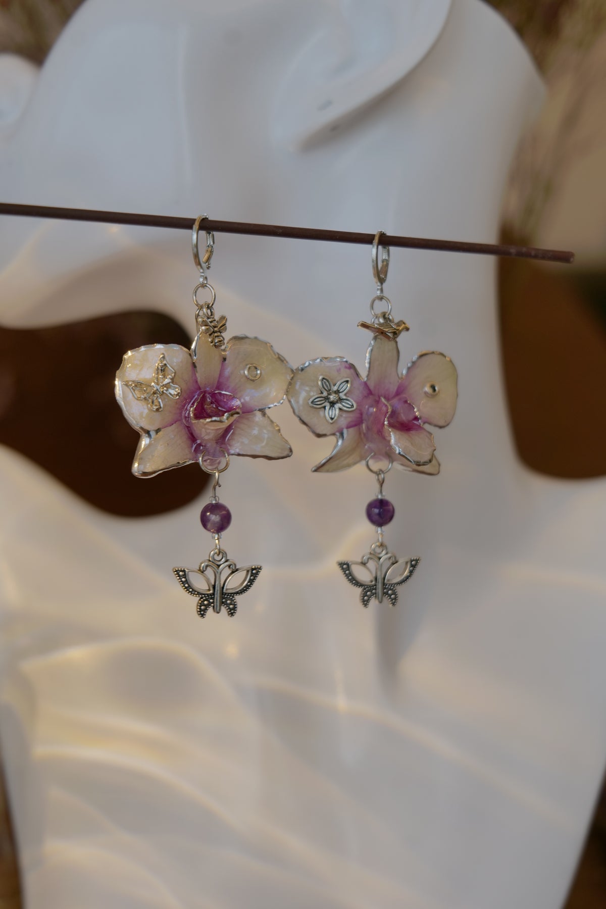 LUNARIA — Asymmetric Dendrobium Butterfly & Bee Earrings by Terra Decode — product photograph 4 showing the handmade botanical earrings.