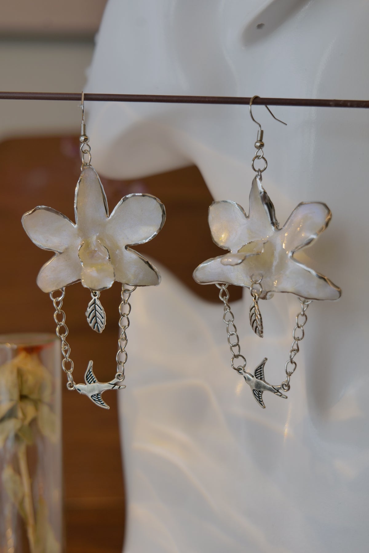 ALBION — White Dendrobium Bird Dangle Earrings by Terra Decode — product photograph 1 showing the handmade botanical earrings.
