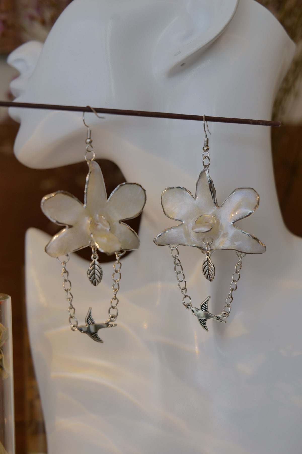 ALBION — White Dendrobium Bird Dangle Earrings by Terra Decode — product photograph 2 showing the handmade botanical earrings.