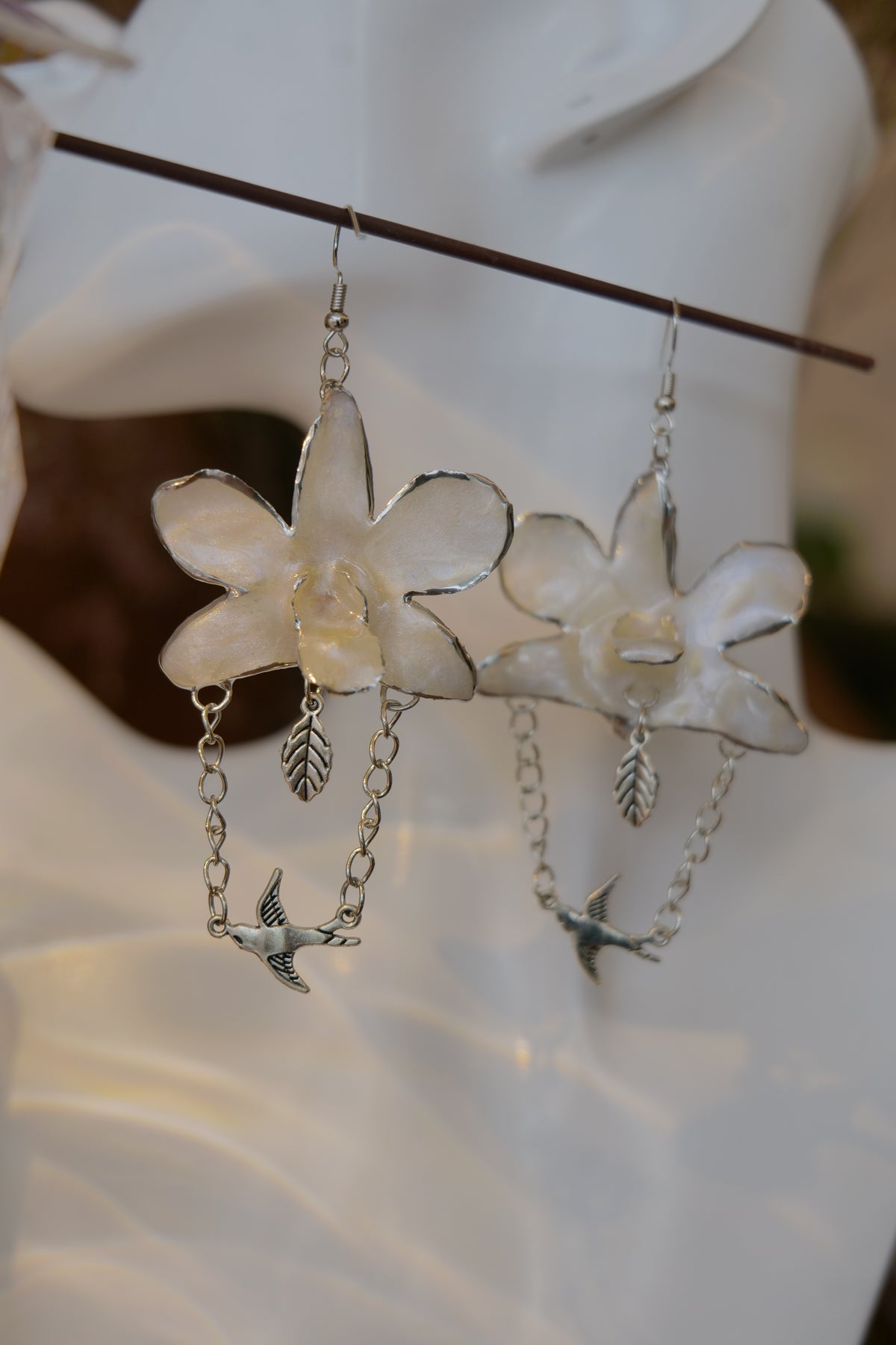 ALBION — White Dendrobium Bird Dangle Earrings by Terra Decode — product photograph 5 showing the handmade botanical earrings.