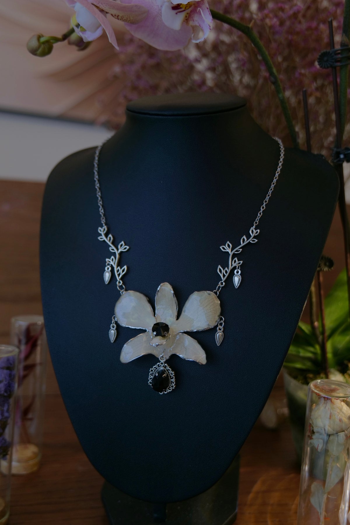 NOCTURNE — White Dendrobium Black Crystal Vintage Pendant Necklace by Terra Decode — product photograph 1 showing the handmade necklace and botanical details.