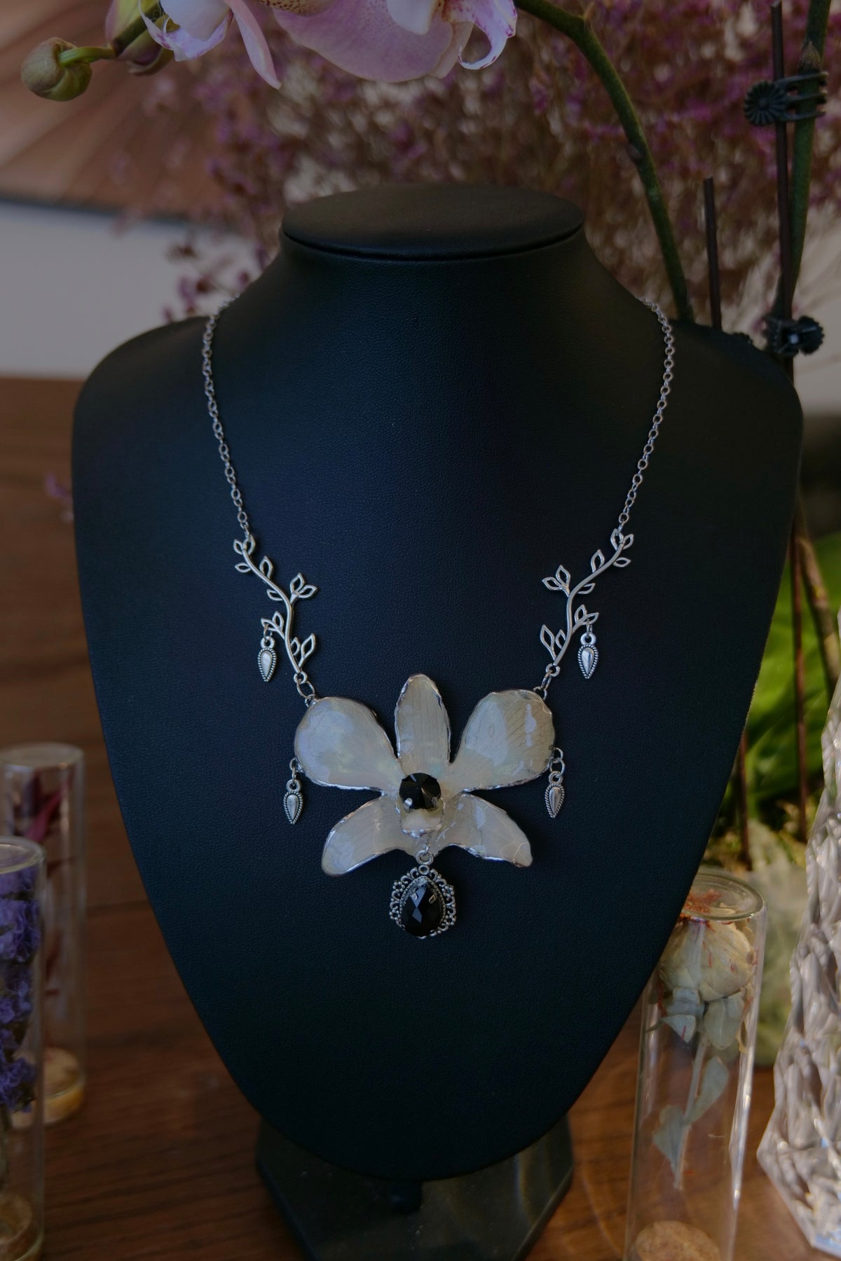 NOCTURNE — White Dendrobium Black Crystal Vintage Pendant Necklace by Terra Decode — product photograph 2 showing the handmade necklace and botanical details.