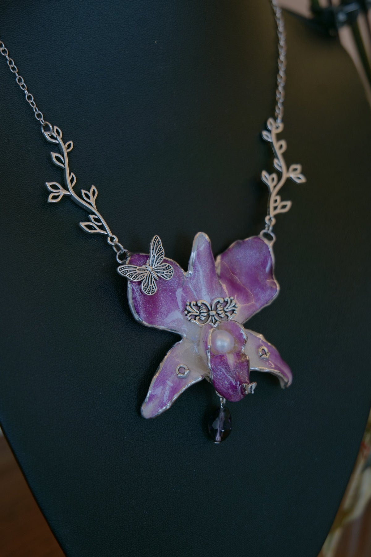 VIOLETTE — Purple Dendrobium Butterfly Branch Pendant Necklace by Terra Decode — product photograph 4 showing the handmade necklace and botanical details.