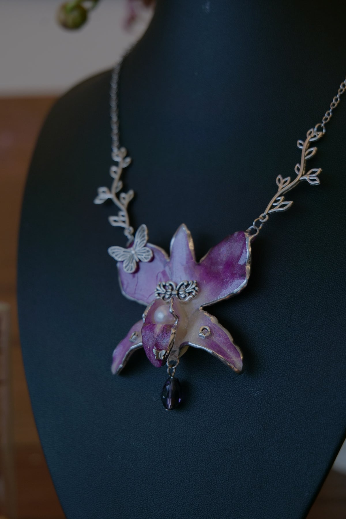 VIOLETTE — Purple Dendrobium Butterfly Branch Pendant Necklace by Terra Decode — product photograph 5 showing the handmade necklace and botanical details.