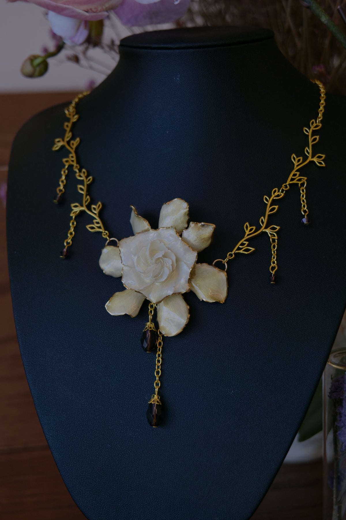 AMETHYSTA — Gardenia Gold Leaf Purple Crystal Pendant Necklace by Terra Decode — product photograph 2 showing the handmade necklace and botanical details.