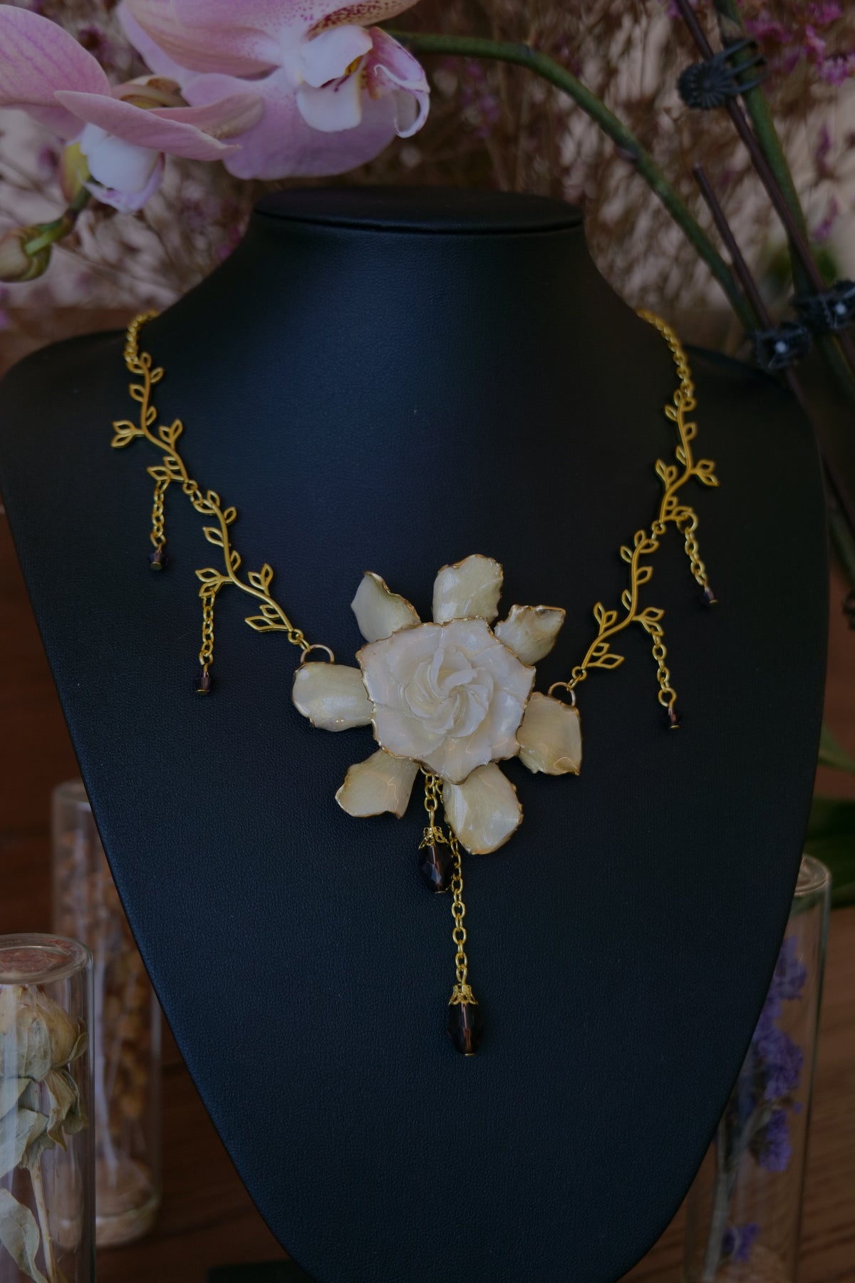 AMETHYSTA — Gardenia Gold Leaf Purple Crystal Pendant Necklace by Terra Decode — product photograph 3 showing the handmade necklace and botanical details.