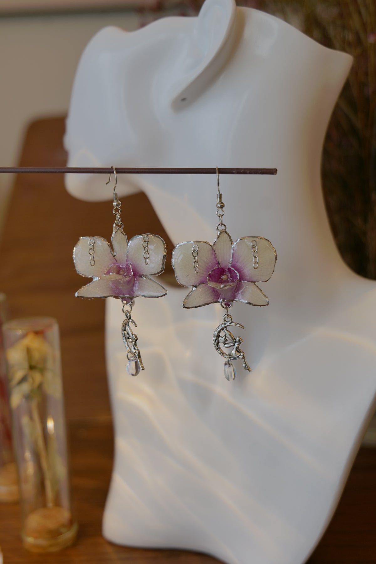 SERAPHIEL — Dendrobium Angel Charm Colour-Shift Earrings by Terra Decode — product photograph 3 showing the handmade botanical earrings.