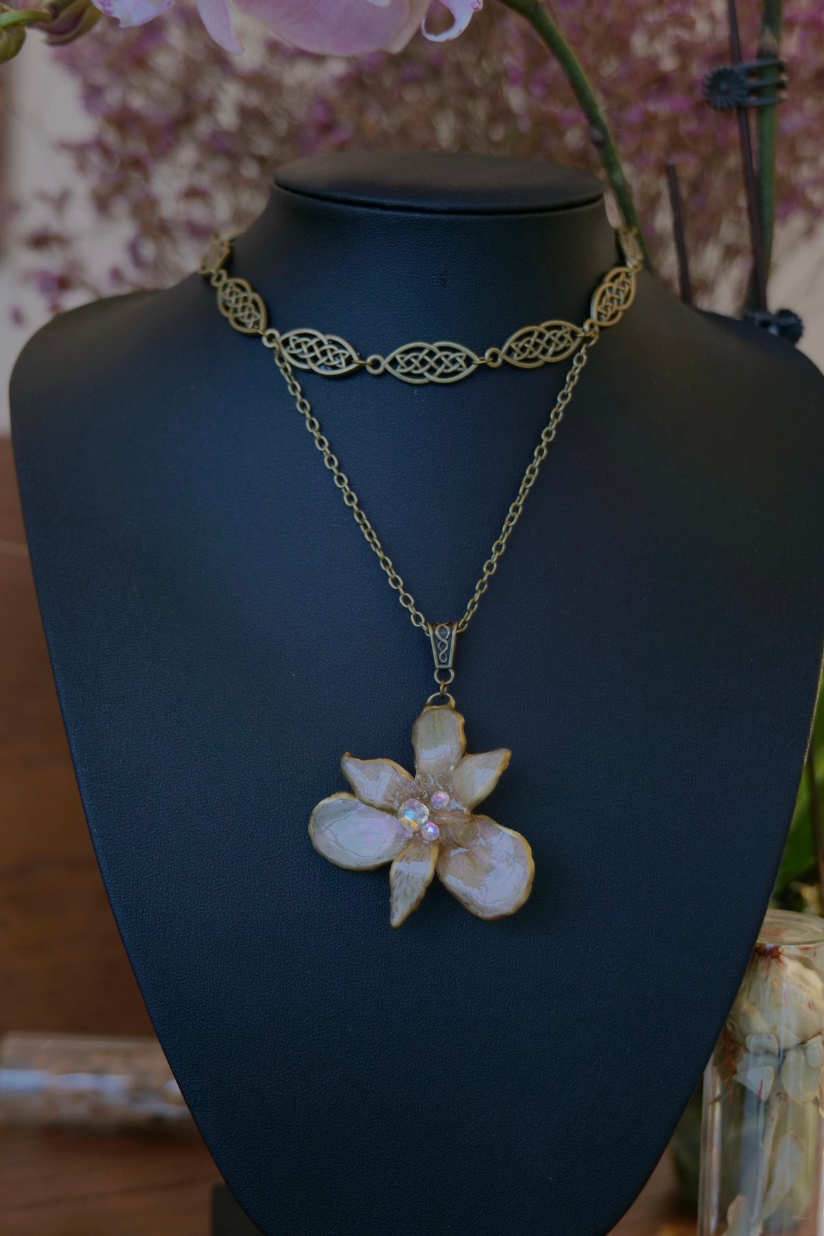 BRIGID — Celtic Peruvian Lily Iridescent Rhinestone Necklace by Terra Decode — product photograph 1 showing the handmade botanical necklace.
