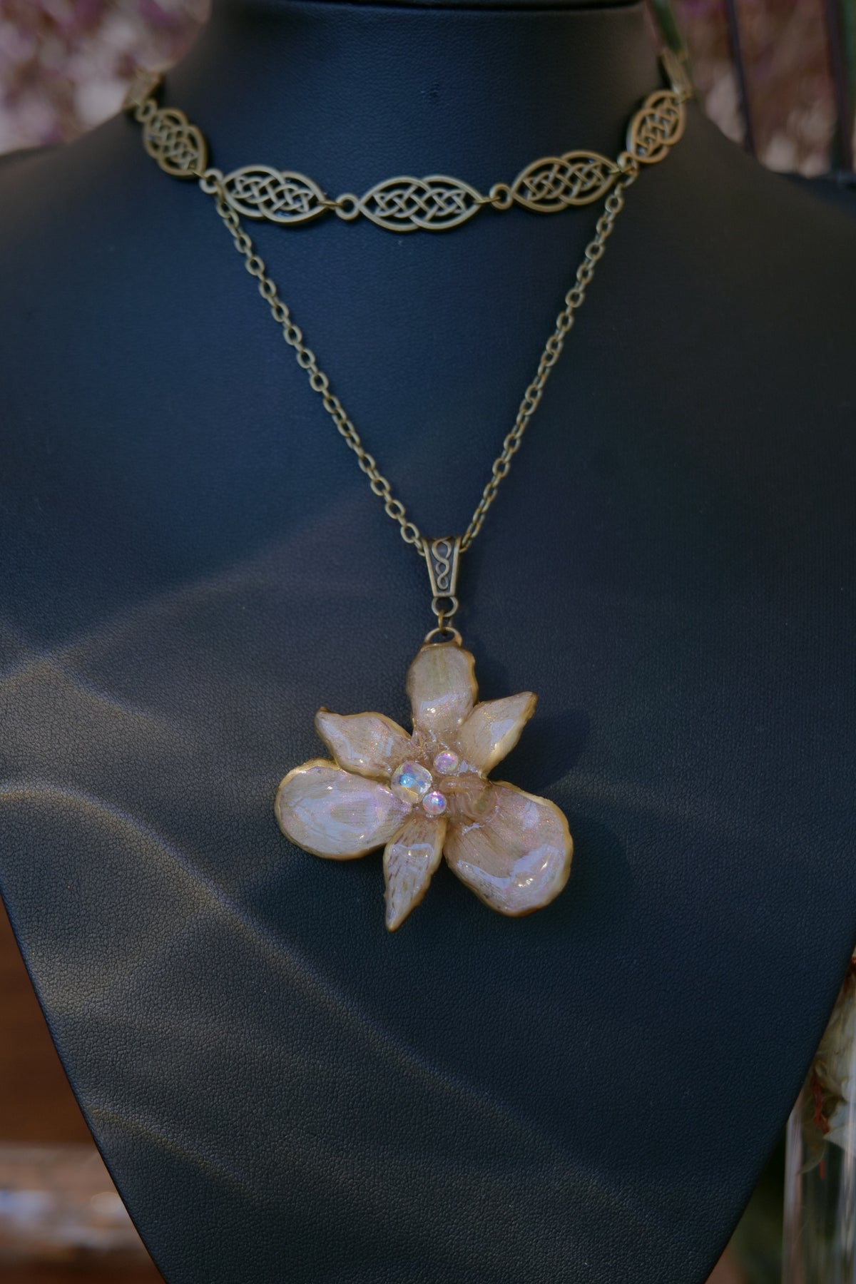 BRIGID — Celtic Peruvian Lily Iridescent Rhinestone Necklace by Terra Decode — product photograph 5 showing the handmade botanical necklace.