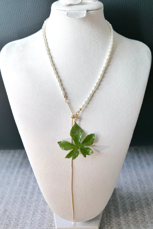 Front view of the Japanese hop leaf on an adjustable imitation-pearl lariat