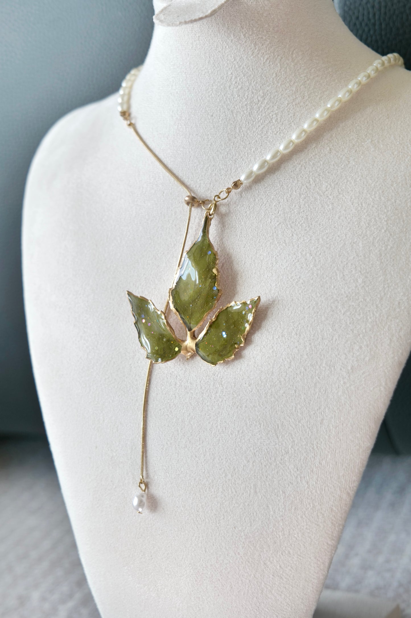 Close-up of Boston ivy leaf veins and gold-toned alloy metal edging