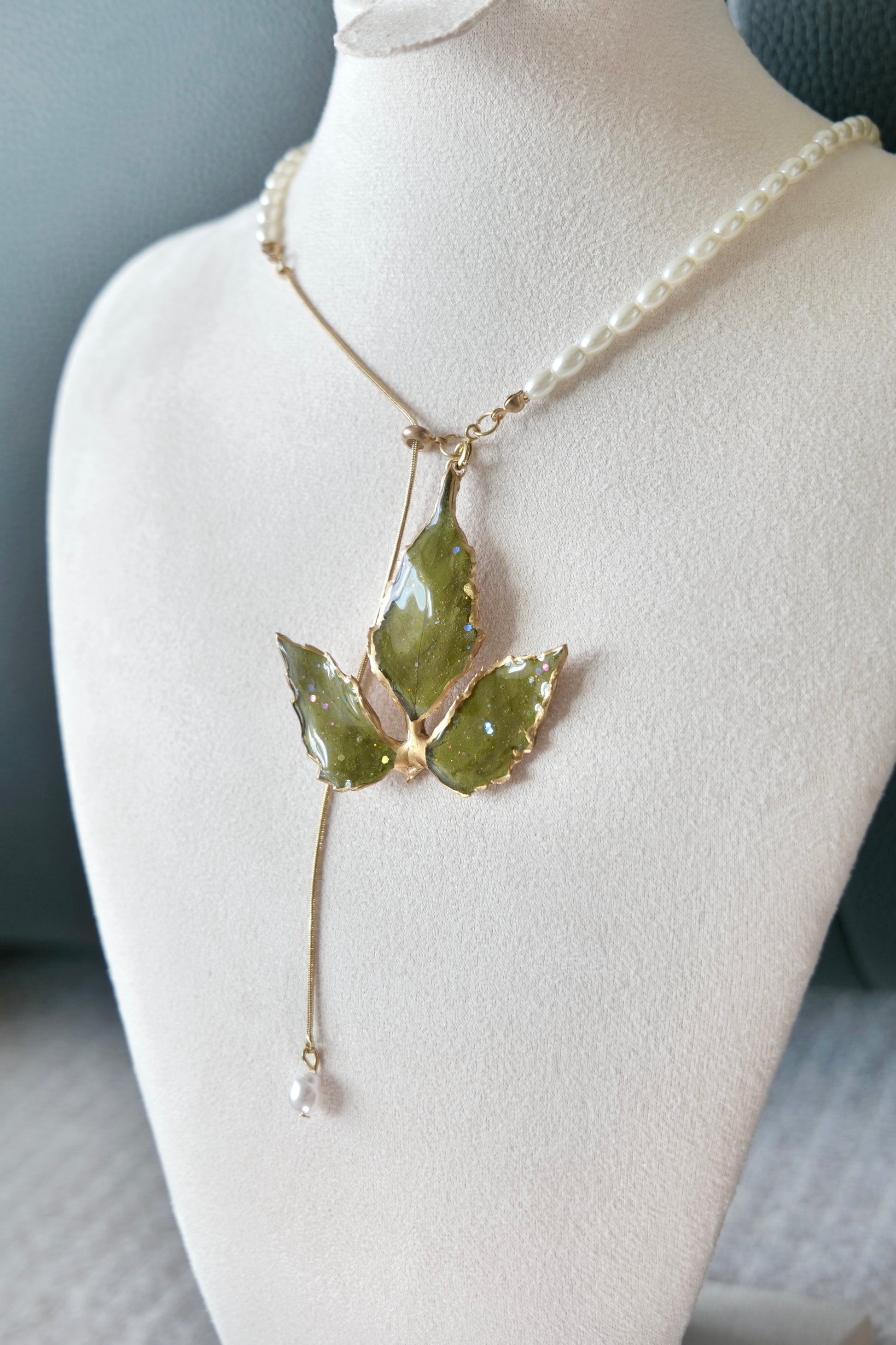 Close-up of Boston ivy leaf veins and gold-toned alloy metal edging
