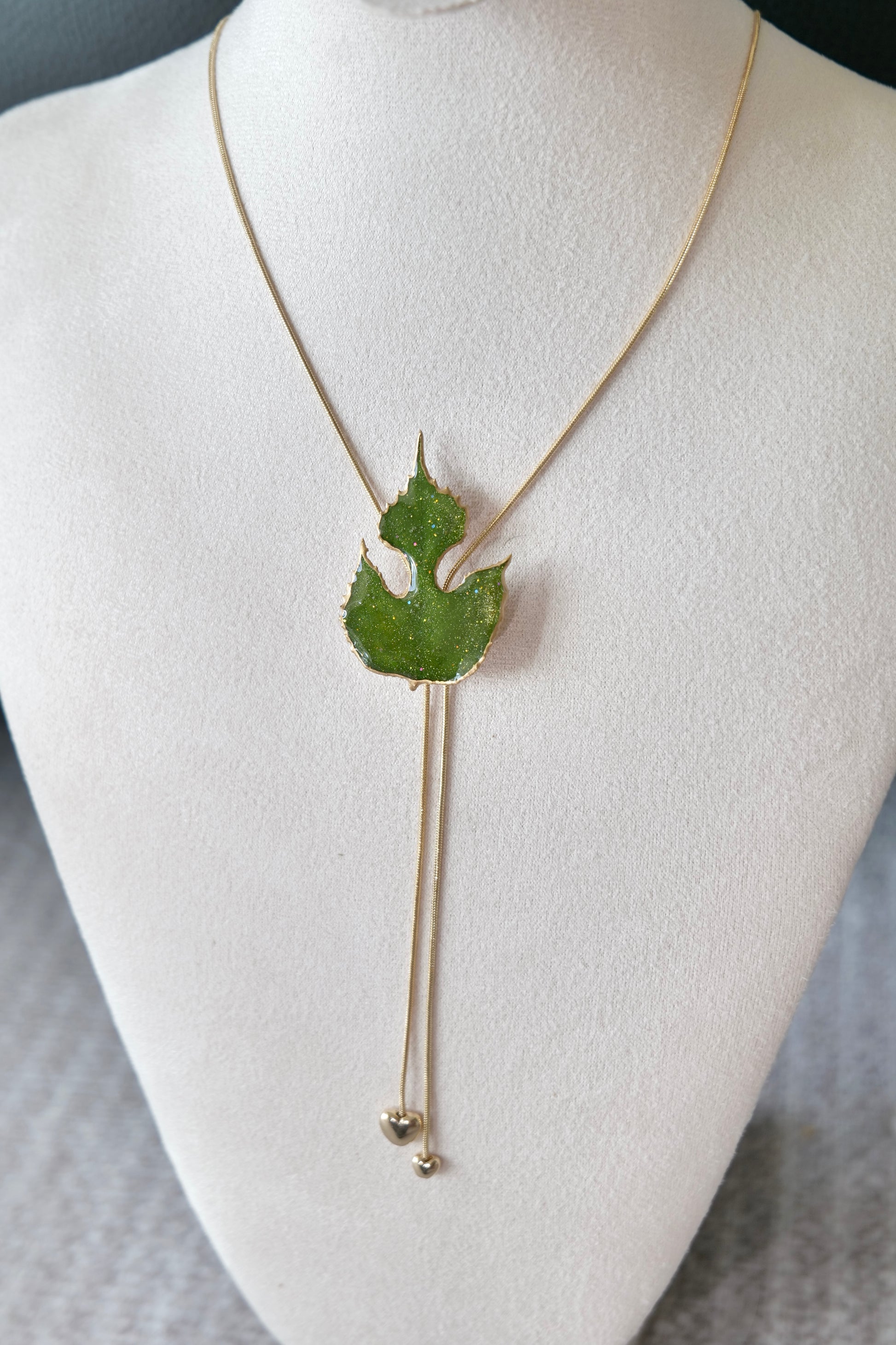 Full-length alternative view of the sculptural green leaf double-heart lariat necklace by Terra Decode