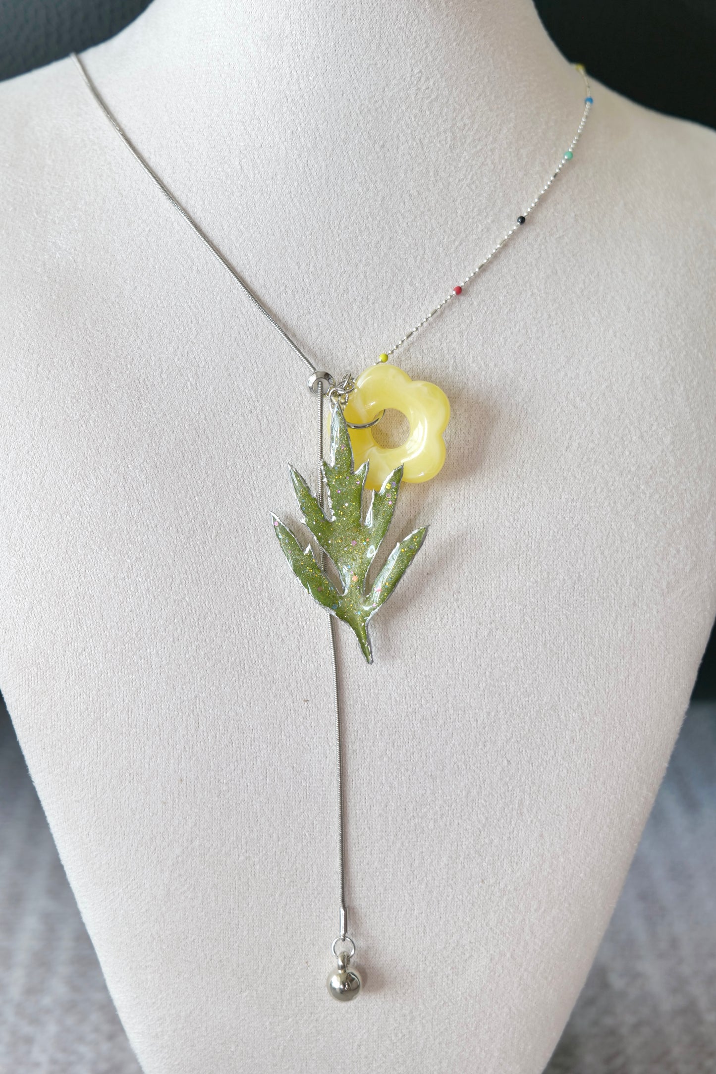 Front view of Chinese mugwort, coloured-bead chain and yellow acrylic flower charm